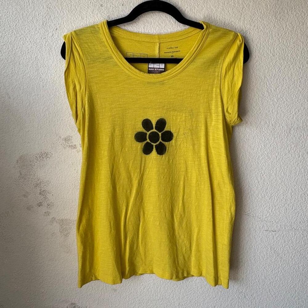 Womens yellow tee featuring 'flower' print